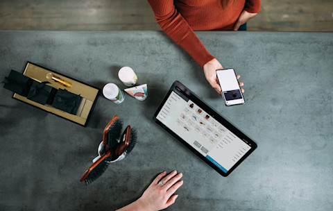 Woman paying with apple pay